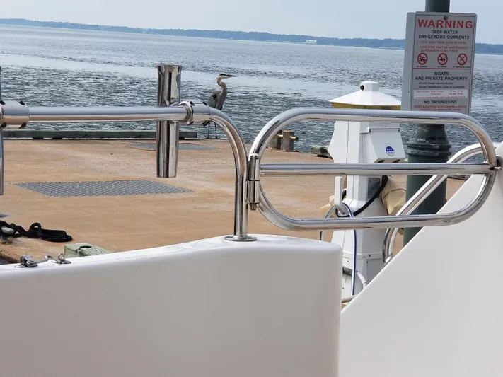 Apaiser Yacht Photos Pics Ocean Alexander 52 Sedan yacht docked by serene waters, 2005 model.