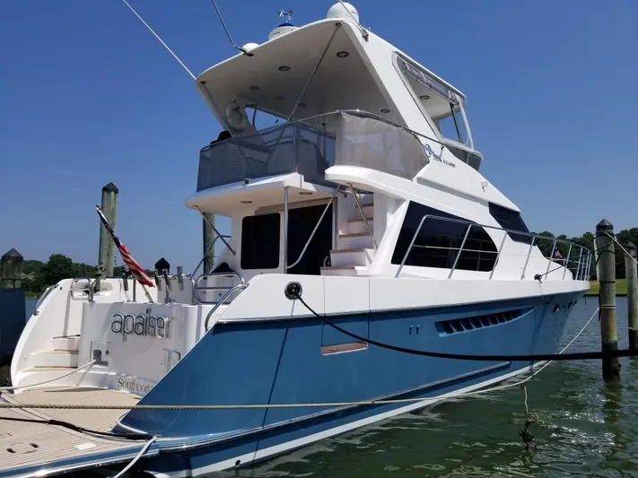 Apaiser Yacht Photos Pics 2005 Ocean Alexander 52 Sedan yacht docked, featuring sleek design and blue hull.