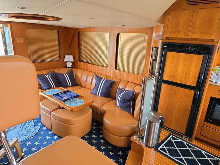 Apaiser Yacht Photos Pics Luxurious interior of 2005 Ocean Alexander 52 Sedan yacht with leather seating and wooden finishes.