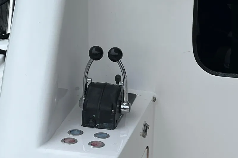 Apaiser Yacht Photos Pics Throttle controls on a 2005 Ocean Alexander 52 Sedan yacht dashboard.
