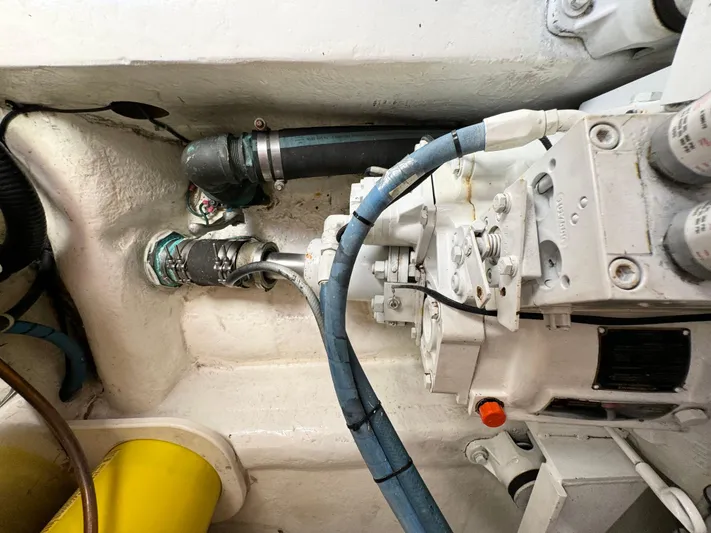  Yacht Photos Pics Engine compartment of 2005 Ocean Yachts 46 Super Sport, showing mechanical components and hoses.