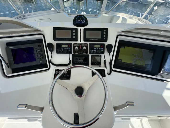  Yacht Photos Pics Helm of 2005 Ocean Yachts 46 Super Sport with navigation and control systems.