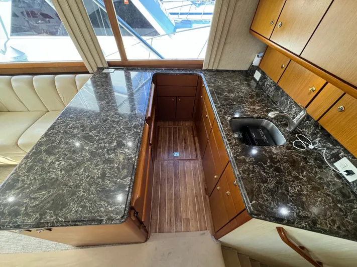  Yacht Photos Pics Luxurious kitchen interior of 2005 Ocean Yachts 46 Super Sport with marble countertops.