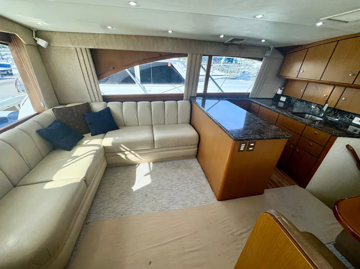 Yacht Photos Pics Luxurious interior of 2005 Ocean Yachts 46 Super Sport with plush seating and elegant cabinetry.