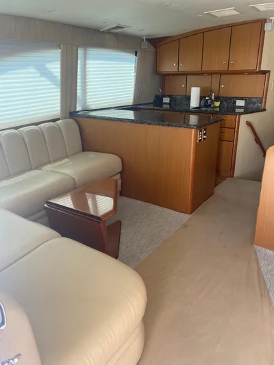  Yacht Photos Pics Interior of 2005 Ocean Yachts 46 Super Sport with beige seating and wooden cabinetry.