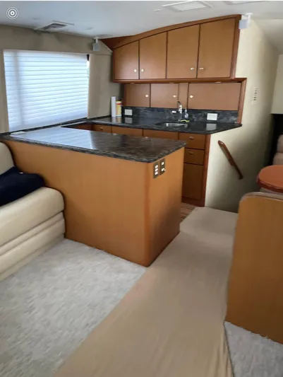  Yacht Photos Pics Interior of 2005 Ocean Yachts 46 Super Sport with modern kitchen and seating area.