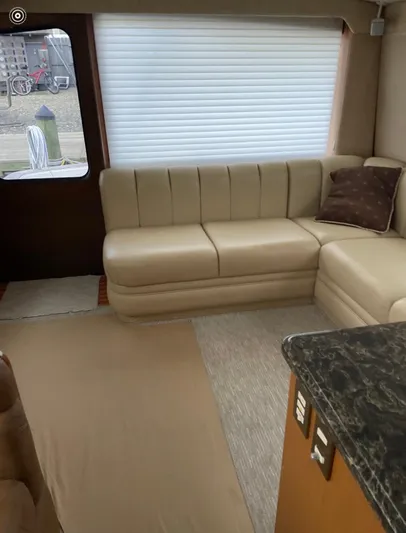  Yacht Photos Pics Interior of 2005 Ocean Yachts 46 Super Sport with beige leather seating and window blinds.
