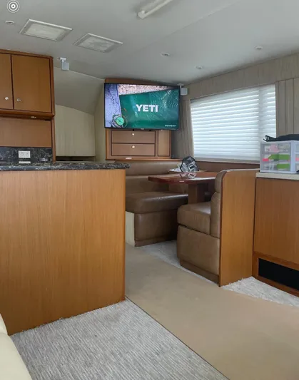  Yacht Photos Pics Interior of 2005 Ocean Yachts 46 Super Sport with TV and dining area.