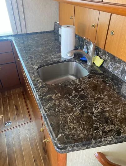  Yacht Photos Pics Luxurious kitchen countertop on 2005 Ocean Yachts 46 Super Sport with sink and faucet.