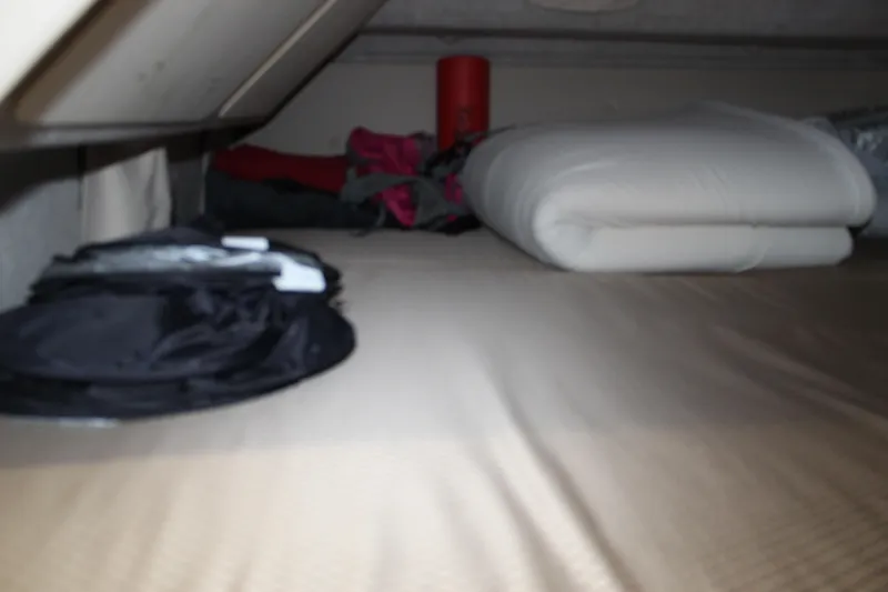 Yacht Photos Pics Storage area inside Aspen B100, 2016 model, with folded bedding and camping gear.