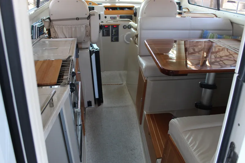  Yacht Photos Pics Interior of 2016 Aspen B100 boat with kitchen and seating area.