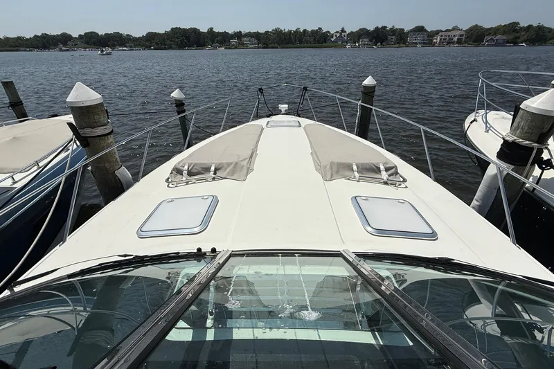  Yacht Photos Pics 2022 Formula 40 Performance Cruiser docked at a marina, viewed from the bow.