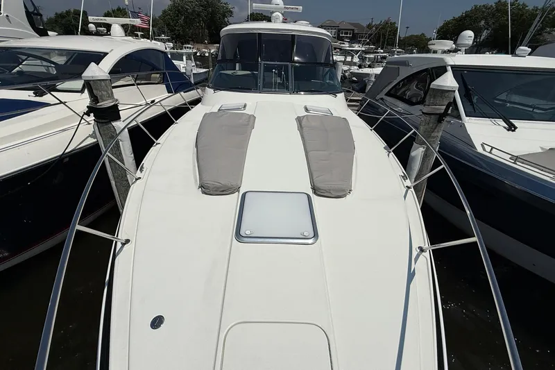  Yacht Photos Pics 2022 Formula 40 Performance Cruiser docked at marina, showcasing sleek design and spacious deck.