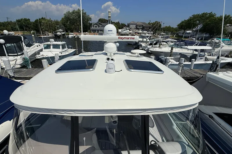  Yacht Photos Pics 2022 Formula 40 Performance Cruiser docked at marina, featuring sleek design and advanced navigation equipment.