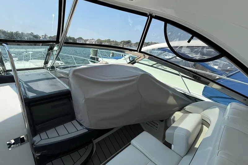  Yacht Photos Pics 2022 Formula 40 Performance Cruiser interior with covered helm and seating area.