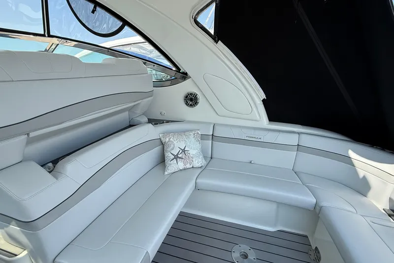  Yacht Photos Pics Luxurious interior of 2022 Formula 40 Performance Cruiser with elegant seating and starfish pillow.