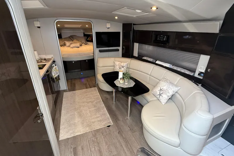  Yacht Photos Pics Luxurious interior of 2022 Formula 40 Performance Cruiser with modern seating and cozy bedroom.