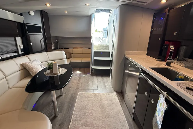  Yacht Photos Pics Interior of 2022 Formula 40 Performance Cruiser with modern kitchen and seating area.