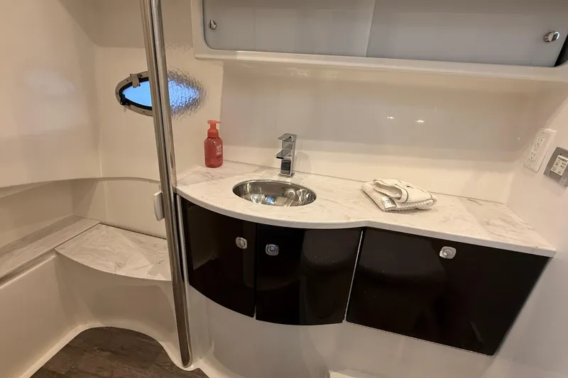  Yacht Photos Pics Modern bathroom in 2022 Formula 40 Performance Cruiser with sleek sink and storage cabinets.