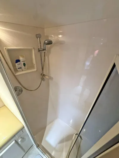  Yacht Photos Pics Shower area in a 1998 Viking 58 Convertible yacht.