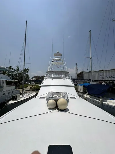  Yacht Photos Pics 1998 Viking 58 Convertible yacht docked at a marina.