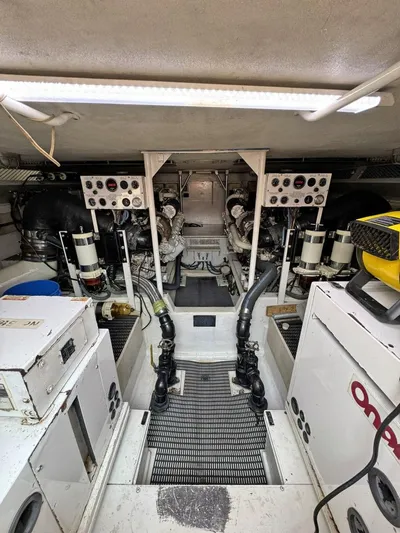  Yacht Photos Pics Engine room of a 1998 Viking 58 Convertible yacht with visible machinery and controls.