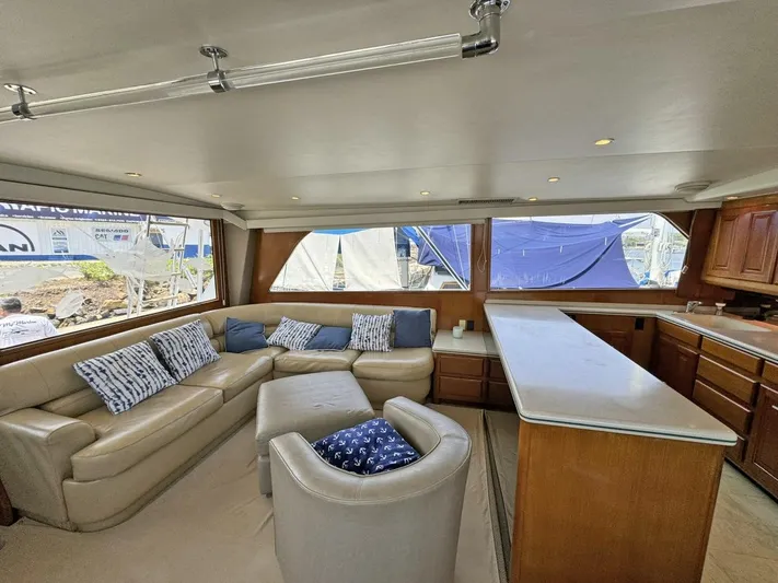  Yacht Photos Pics Interior of 1998 Viking 58 Convertible yacht with leather seating and large windows.