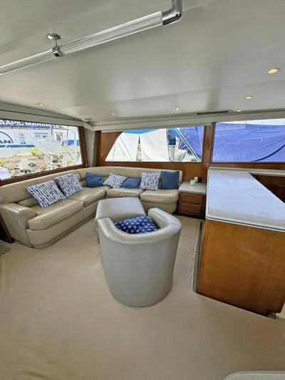  Yacht Photos Pics Interior of 1998 Viking 58 Convertible yacht with beige seating and blue accents.