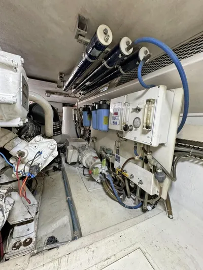  Yacht Photos Pics Engine room of a 1998 Viking 58 Convertible yacht with various mechanical components.