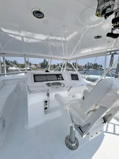  Yacht Photos Pics 1998 Viking 58 Convertible yacht helm station with modern navigation equipment.