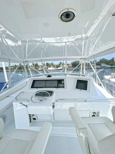  Yacht Photos Pics 1998 Viking 58 Convertible yacht helm with navigation equipment.