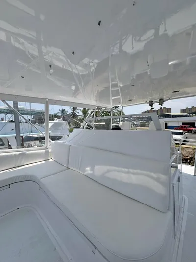  Yacht Photos Pics 1998 Viking 58 Convertible yacht with white seating area.