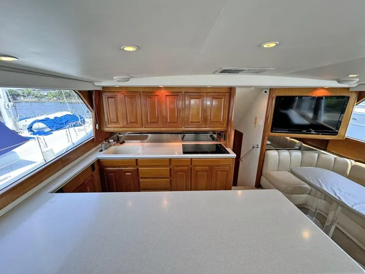  Yacht Photos Pics Interior of 1998 Viking 58 Convertible yacht with modern kitchen and seating area.