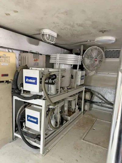  Yacht Photos Pics Engine room of a 1998 Viking 58 Convertible yacht with machinery and equipment.