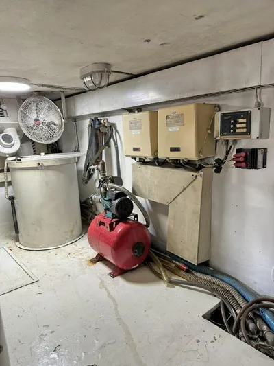  Yacht Photos Pics Engine room of a 1998 Viking 58 Convertible yacht with equipment and machinery.