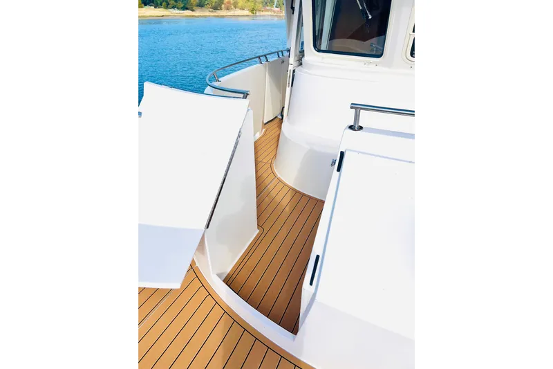 Journey Yacht Photos Pics Deck view of 2001 Bracewell Latitude 47 yacht, featuring sleek design and wood finish.