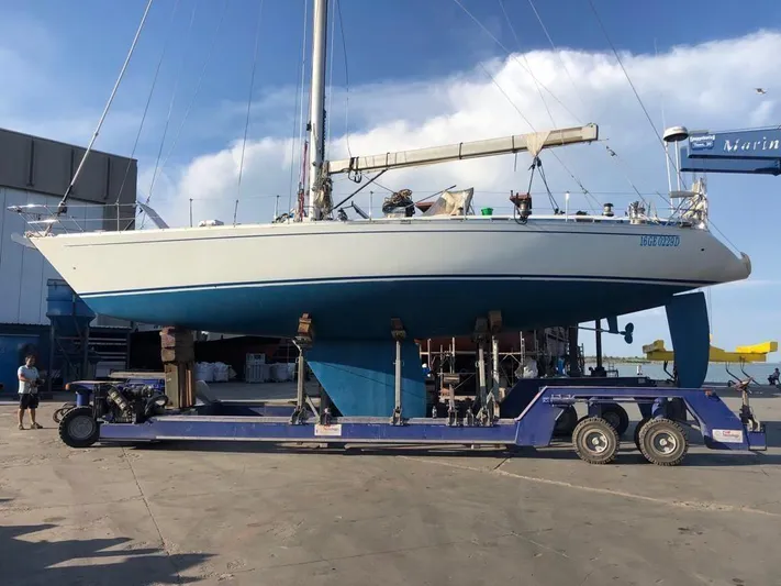  Yacht Photos Pics Grand Soleil 52 sailboat from 1989 on a trailer at a marina.