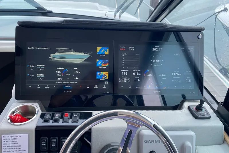 Camelot Yacht Photos Pics Dashboard of 2022 Regal 36 XO boat with Garmin navigation displays.