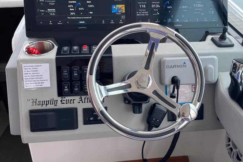 Camelot Yacht Photos Pics 2022 Regal 36 XO boat helm with Garmin navigation and controls.