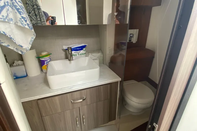 Camelot Yacht Photos Pics Modern bathroom in 2022 Regal 36 XO yacht with sink and toilet.
