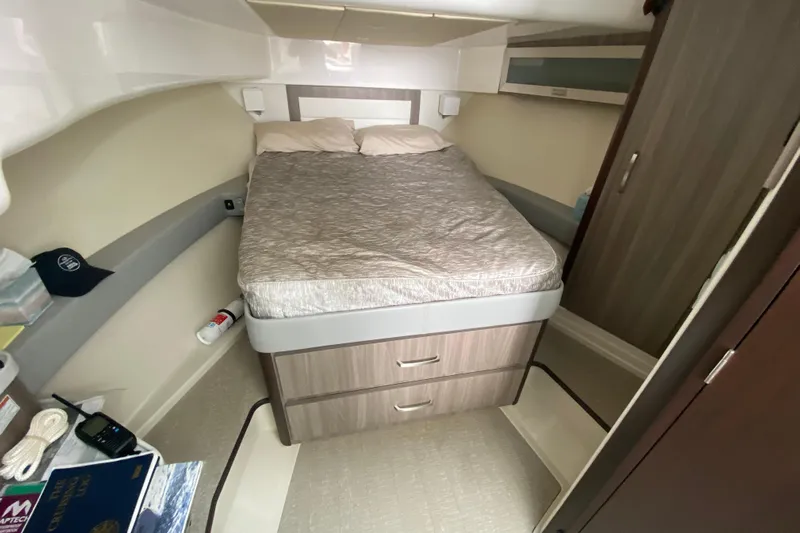 Camelot Yacht Photos Pics 2022 Regal 36 XO cabin interior with bed and storage drawers.