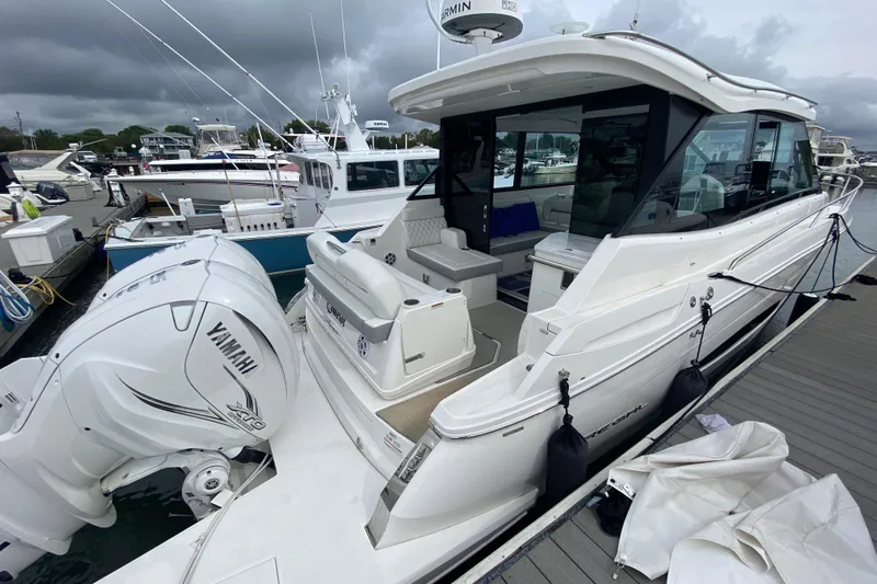 Camelot Yacht Photos Pics 2022 Regal 36 XO yacht docked, featuring Yamaha outboard engines and sleek design.