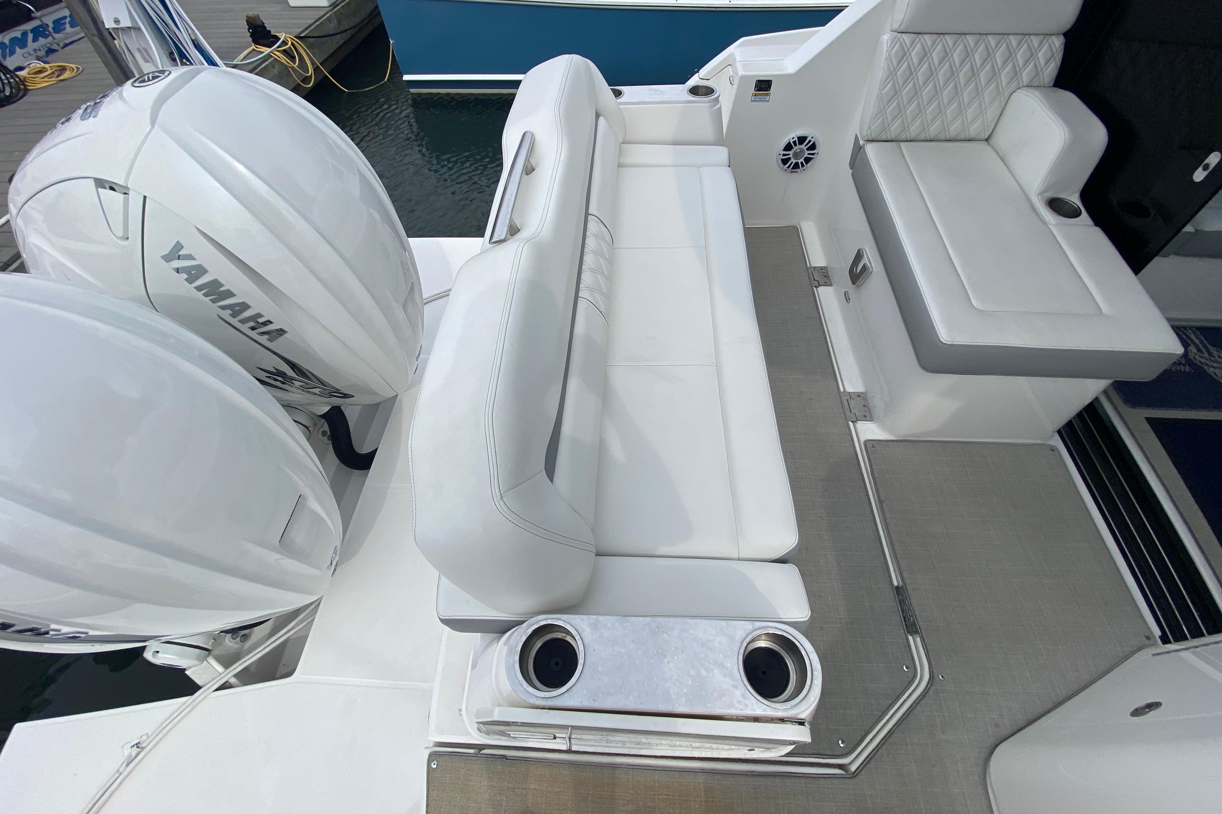 2022 Regal 36 XO boat interior with Yamaha engines and white seating.