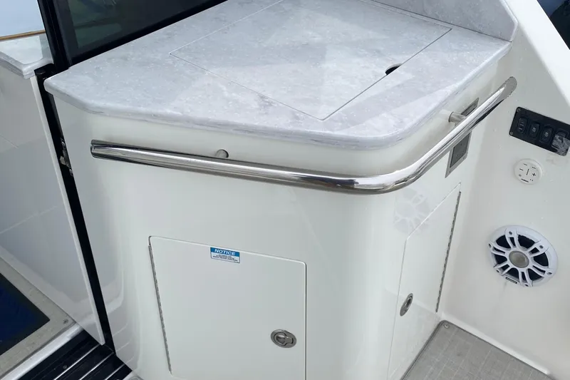 Camelot Yacht Photos Pics 2022 Regal 36 XO yacht interior with sleek countertop and modern amenities.