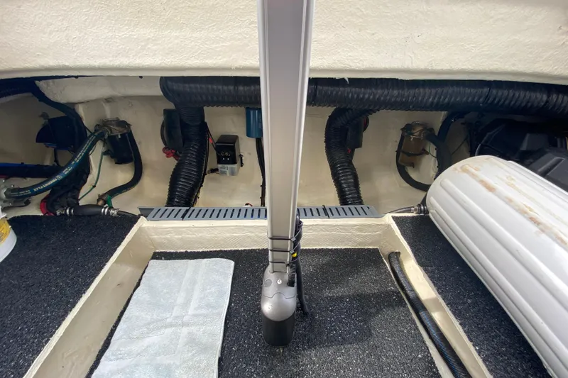 Camelot Yacht Photos Pics Engine compartment of a 2022 Regal 36 XO boat, showcasing wiring and components.