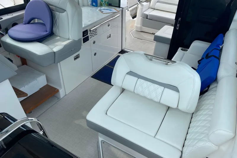 Camelot Yacht Photos Pics Interior of 2022 Regal 36 XO boat with luxurious white seating and modern design.