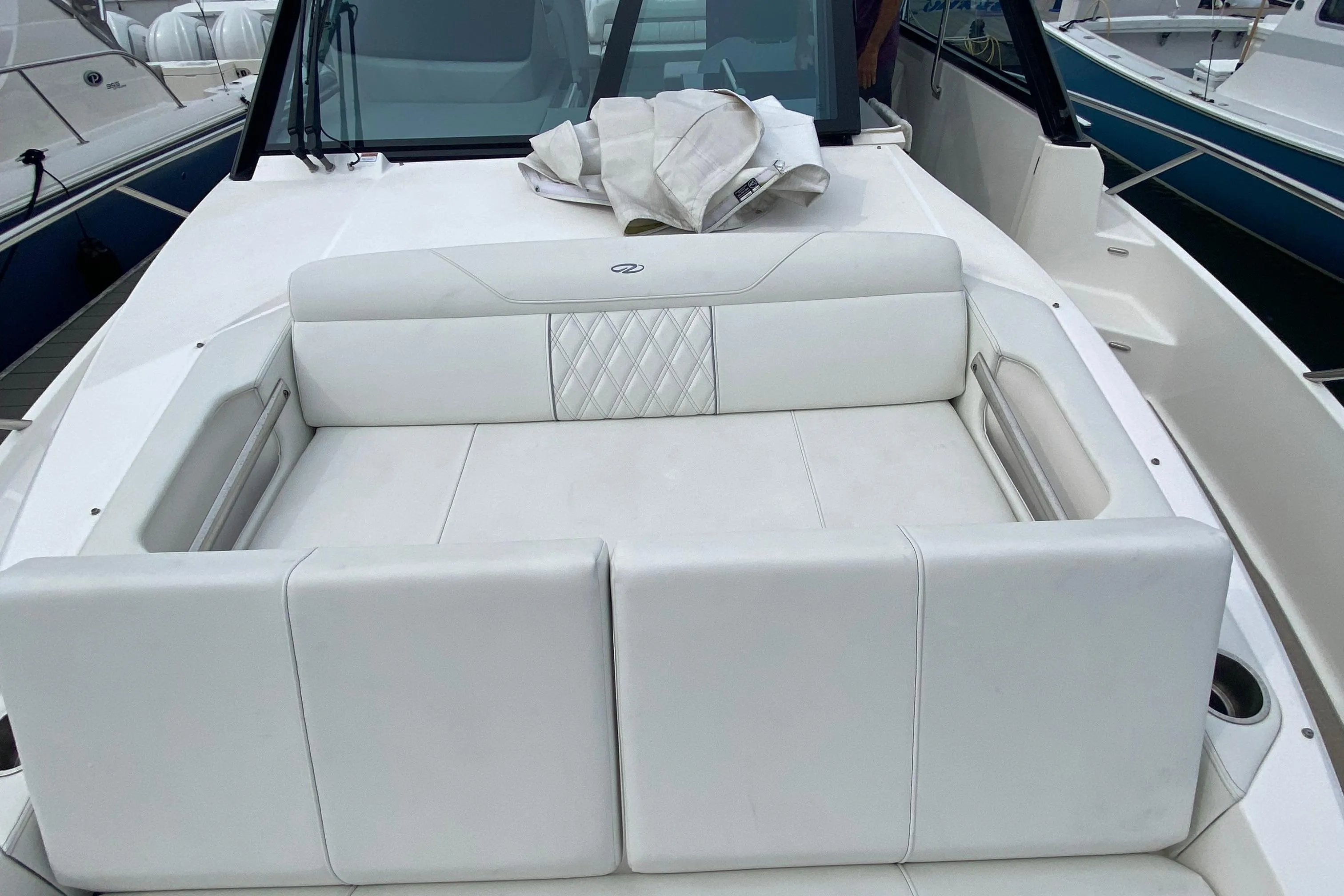 2022 Regal 36 XO boat with luxurious white seating on deck.