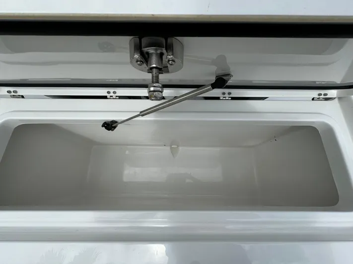  Yacht Photos Pics Open storage compartment of 2022 Sea Hunt 27 Gamefish boat.