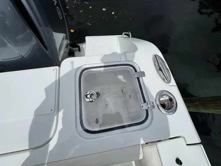  Yacht Photos Pics 2022 Sea Hunt 27 Gamefish boat stern with livewell and engine.