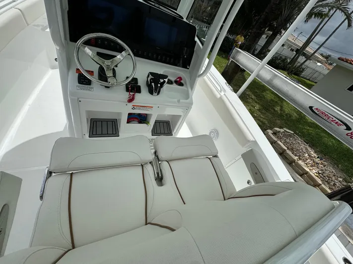  Yacht Photos Pics 2022 Sea Hunt 27 Gamefish boat cockpit with steering wheel and seating.